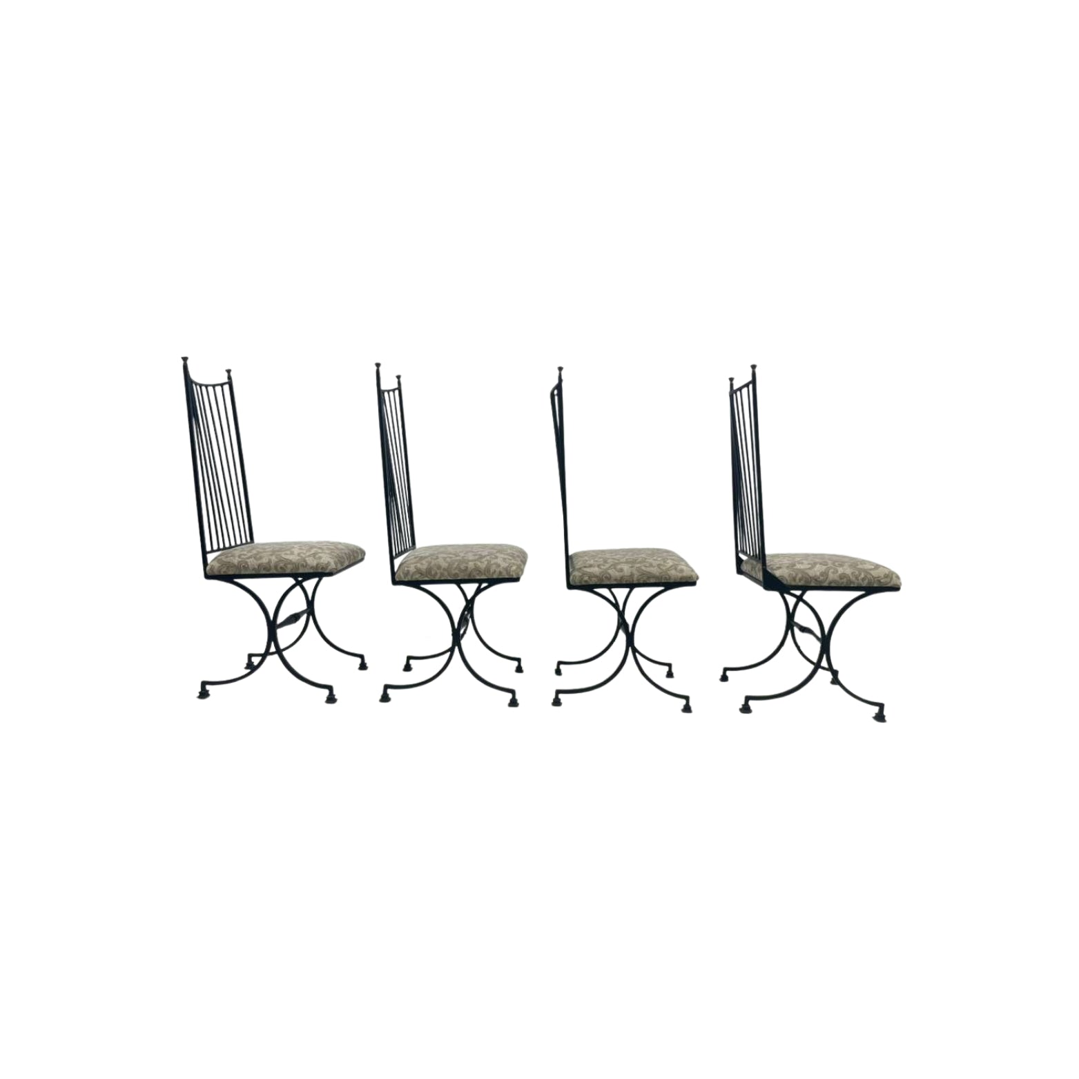 Four black iron chairs with patterned seats
