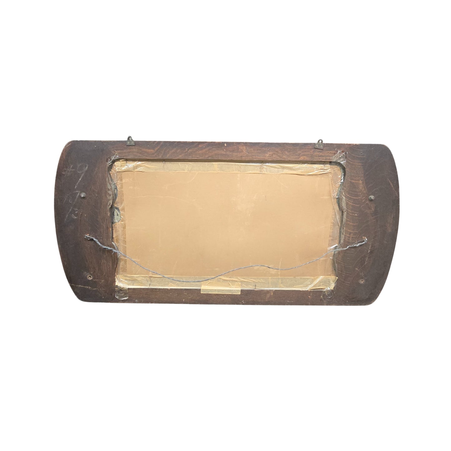 View of the back of a mirror with a wooden frame on a white background
