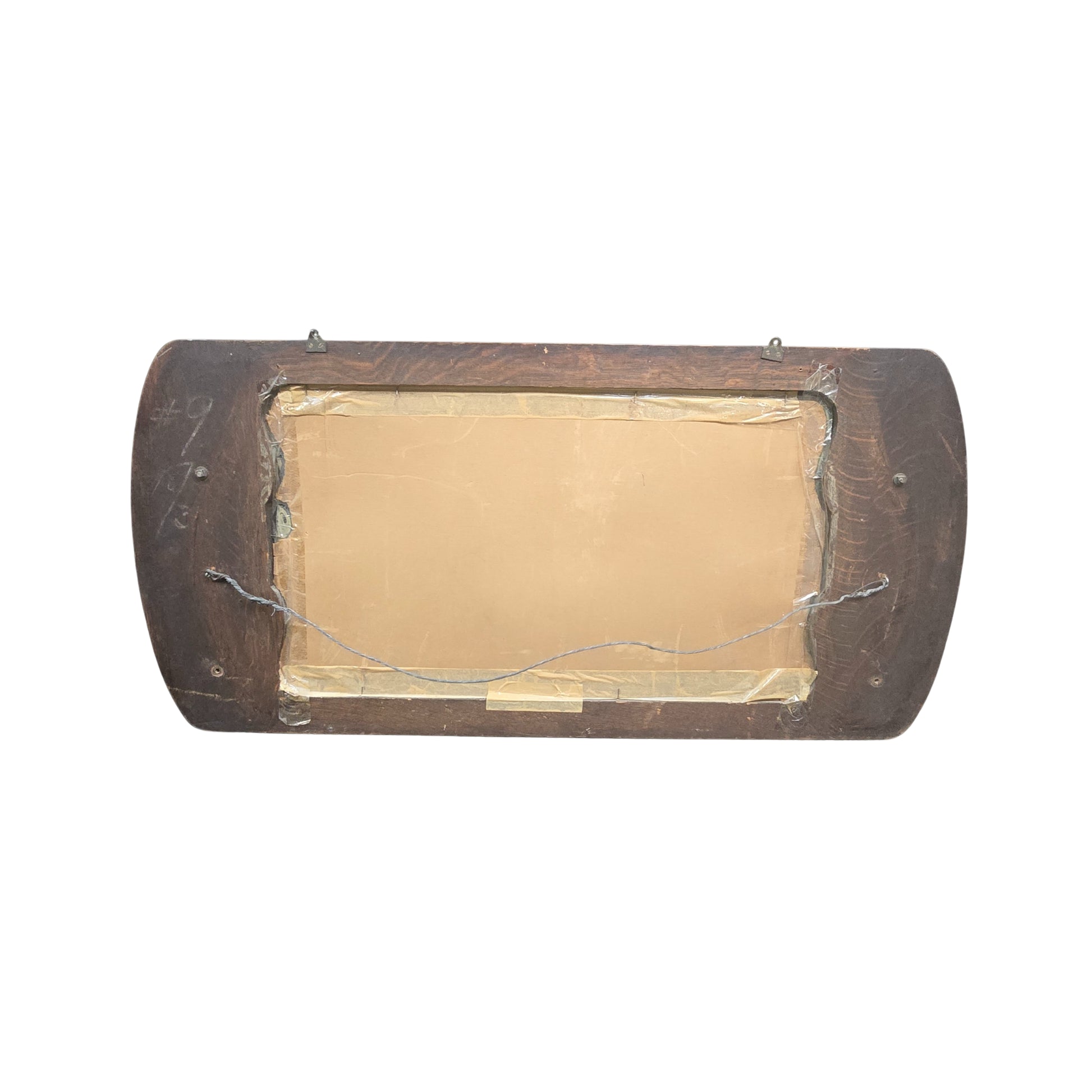 View of the back of a mirror with a wooden frame on a white background