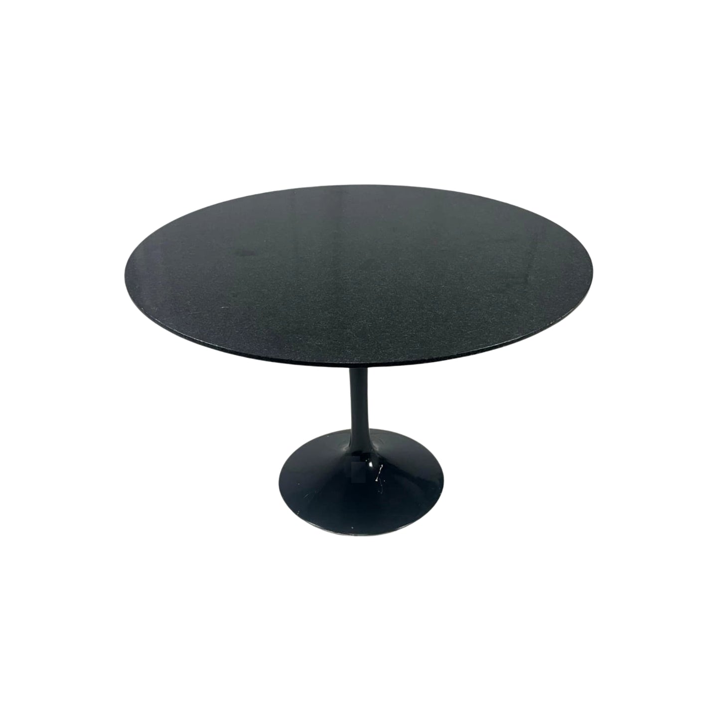 Round black granite table on a white background