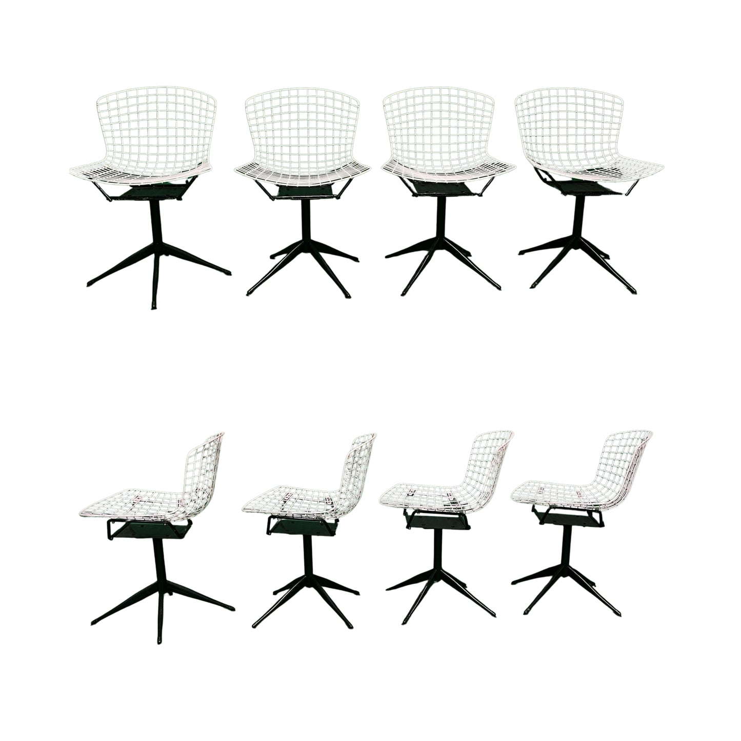 Front and side view of 4 white wrought iron chairs on a white background