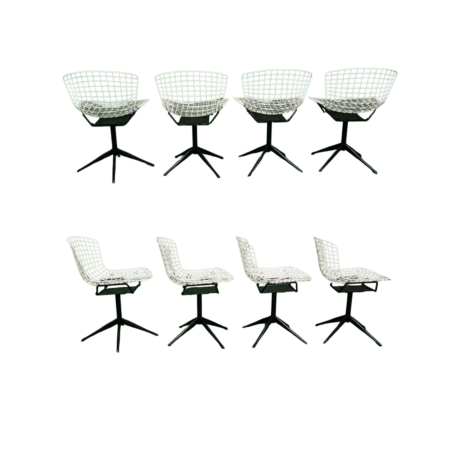 Back and side view of 4 white wrought iron chairs on a white background