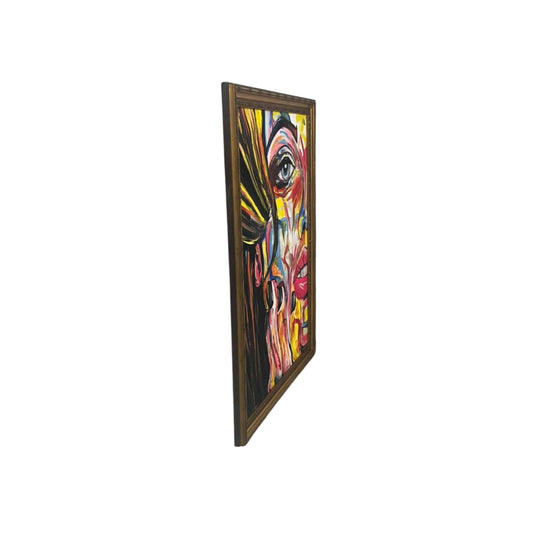 Side view a colorful abstract painting of a face with a gold frame on a white background
