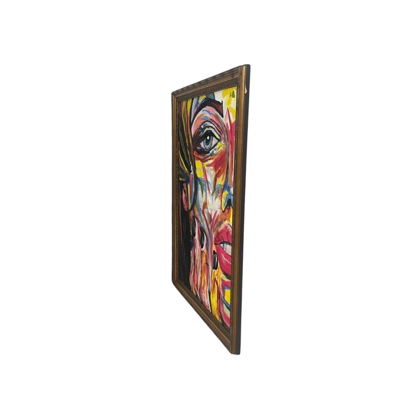 Side view a colorful abstract painting of a face with a gold frame on a white background
