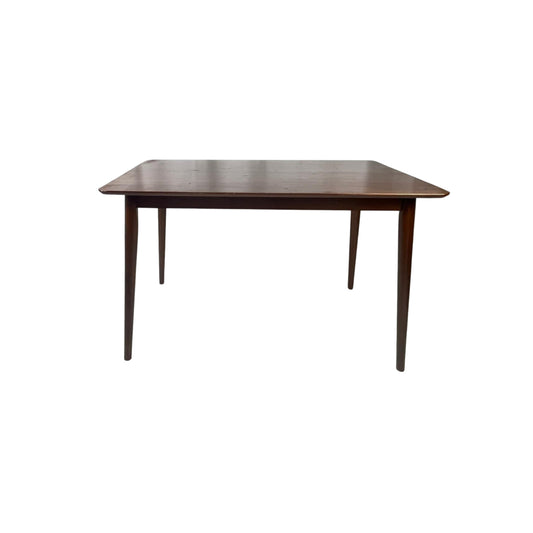 Front view of a rectangular wooden table on a white background