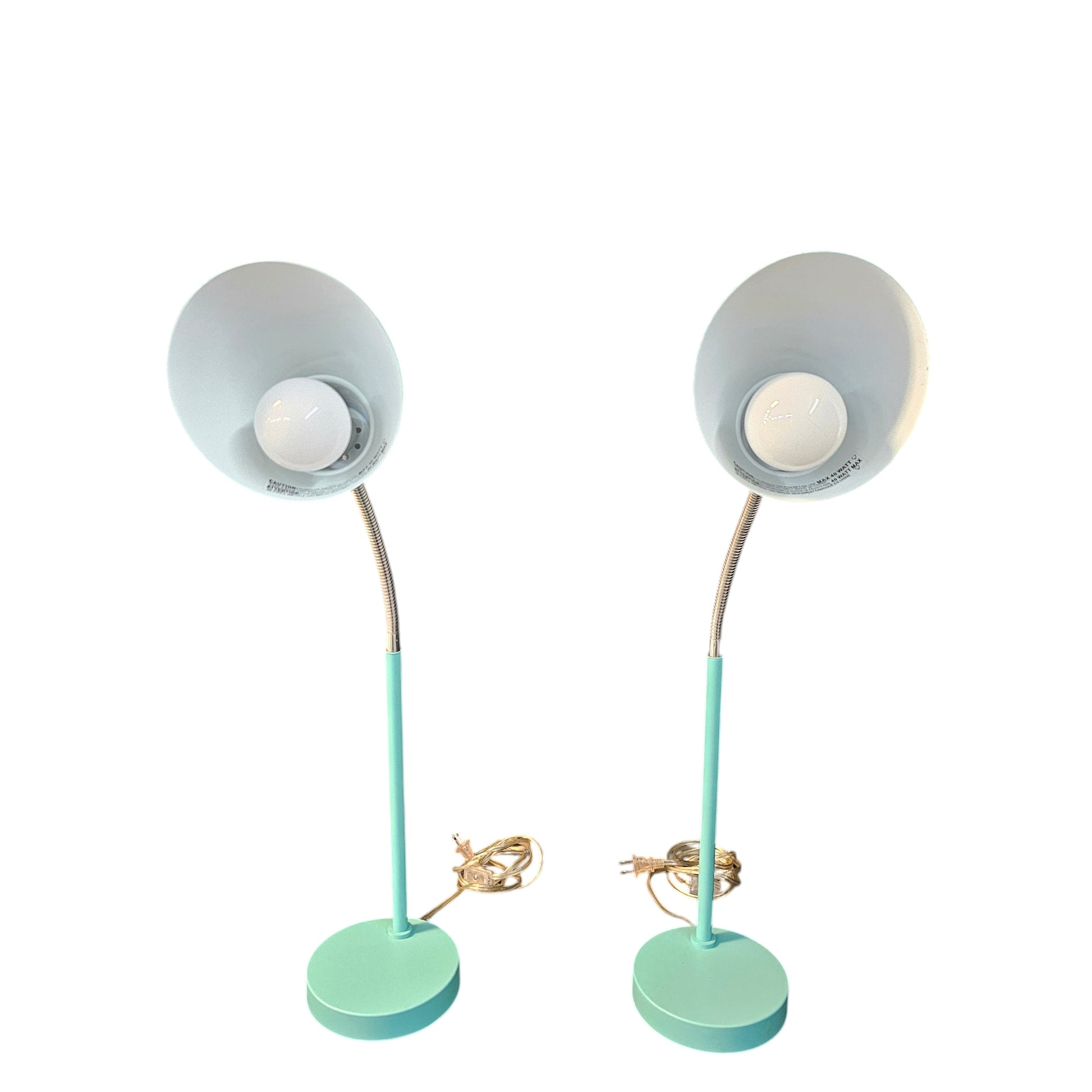 Unleash your inner risk-taker with the MCM Retro style able Lamps in Turquoise Teal, set of 2. These bold, vintage-inspired lamps add a touch of adventure to any room with their vibrant color and sleek design. Elevate your space and make a statement with these retro beauties. set of 2, $41.00 each