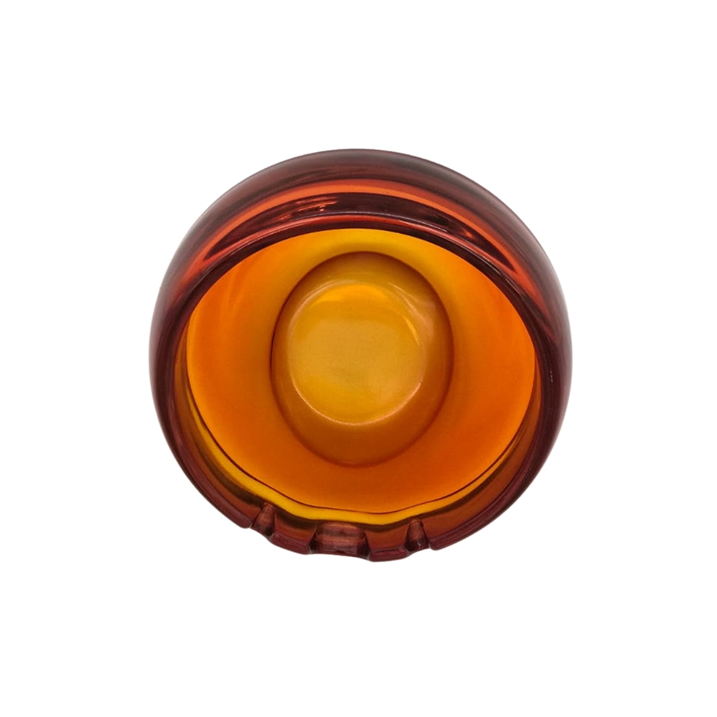 Top view of an orange glass vintage ashtray on a white background