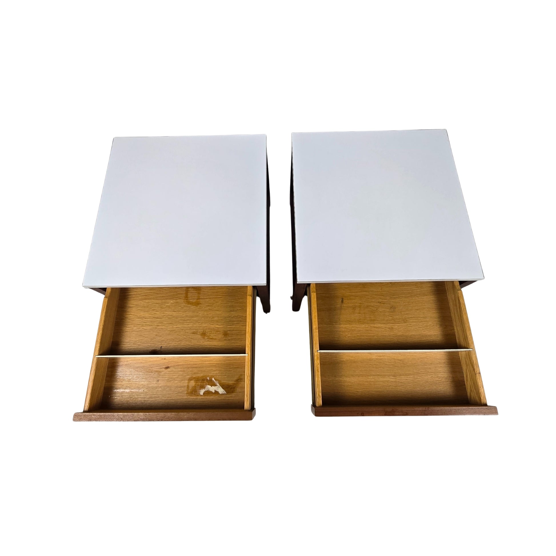 Top view of two wooden nightstands with open drawers against a white background
