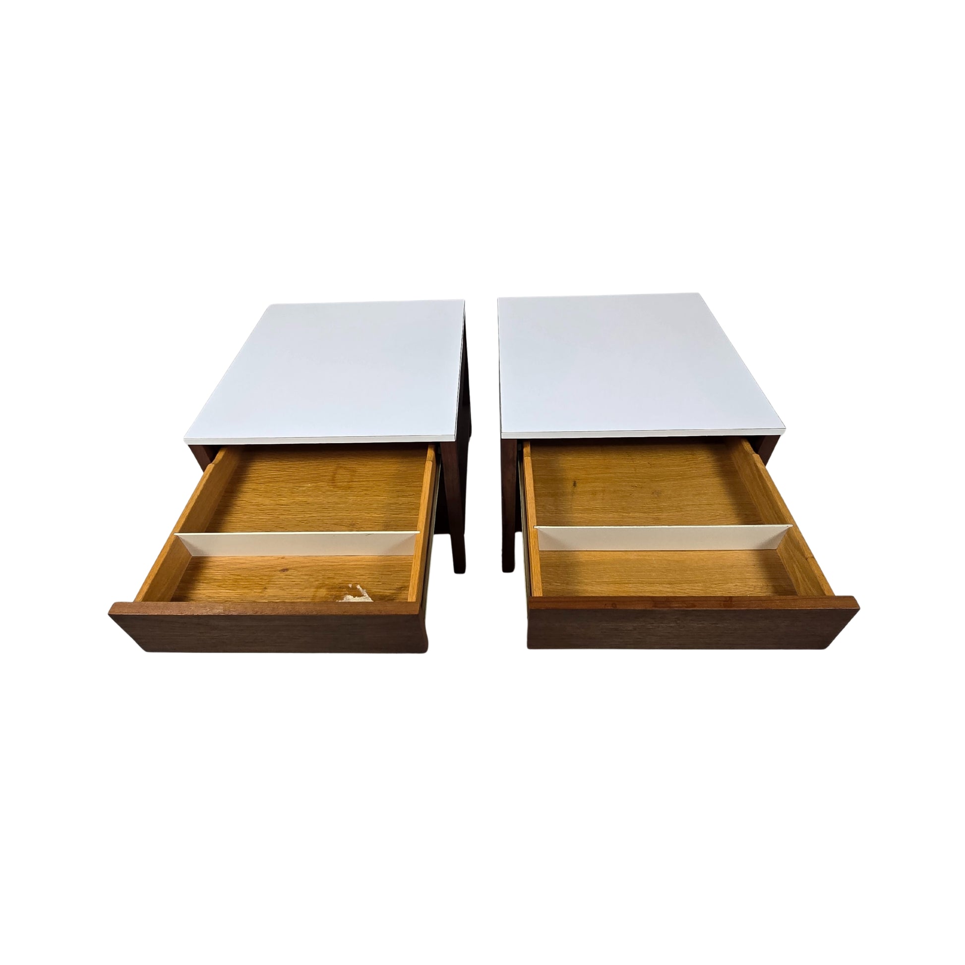 Two white tables with wooden drawers on a white background
