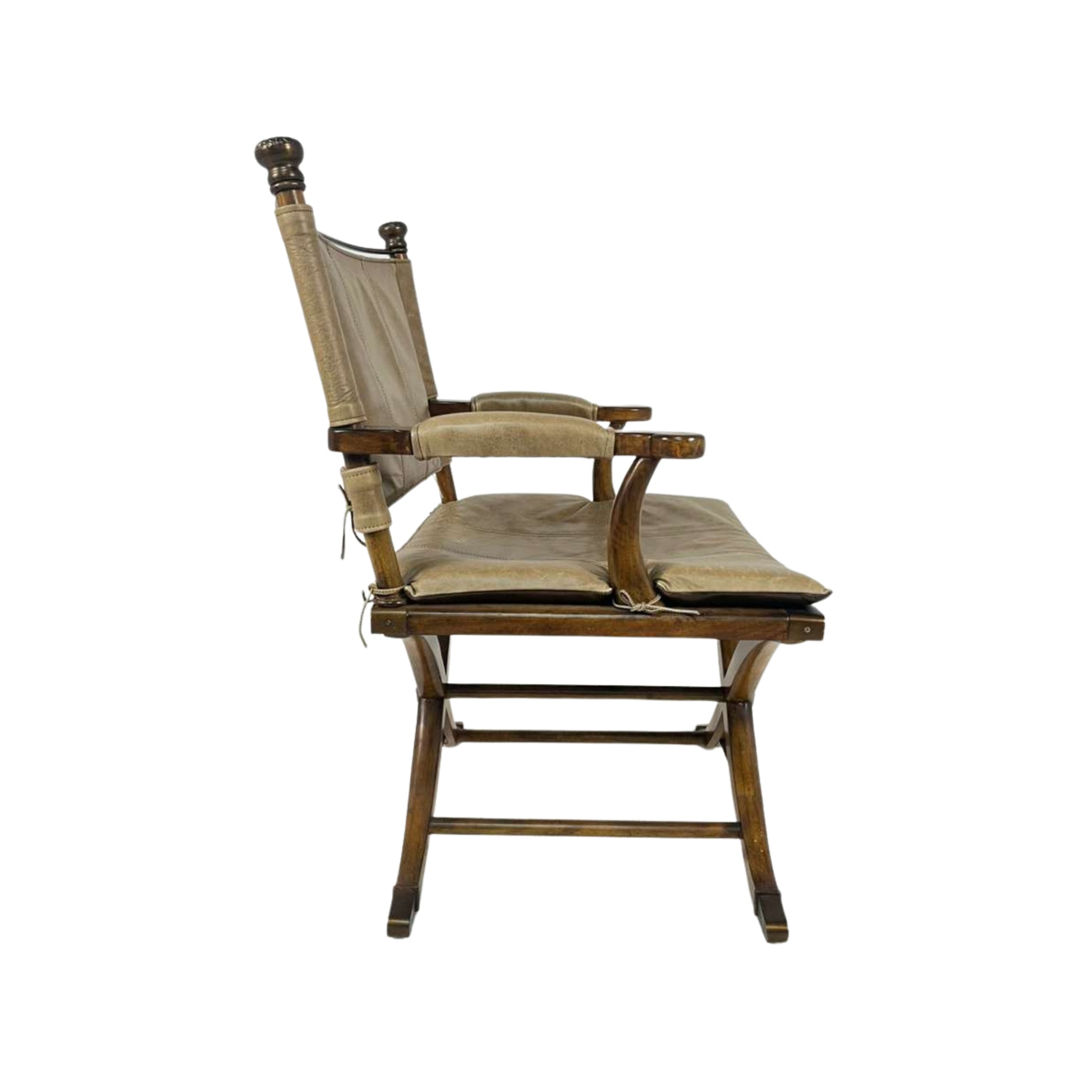 Side view of a wooden chair with a cushioned seat and backrest 