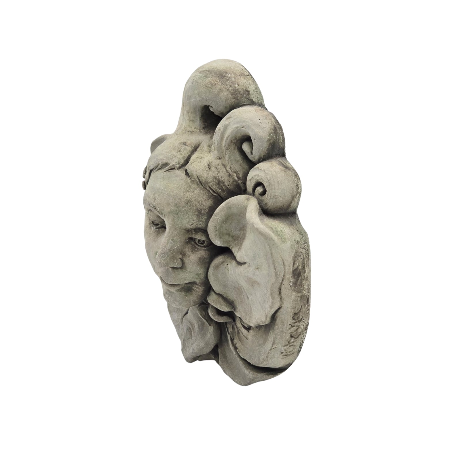 Side view of decorative stone wall plaque with face and floral design on white background