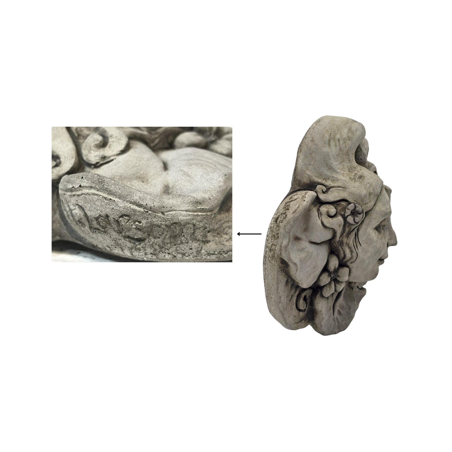Detail of the artist's signature on the decorative stone wall plaque with face and floral design on white background